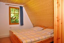 Blick in eine Finnhütte (Schlafzimmer)